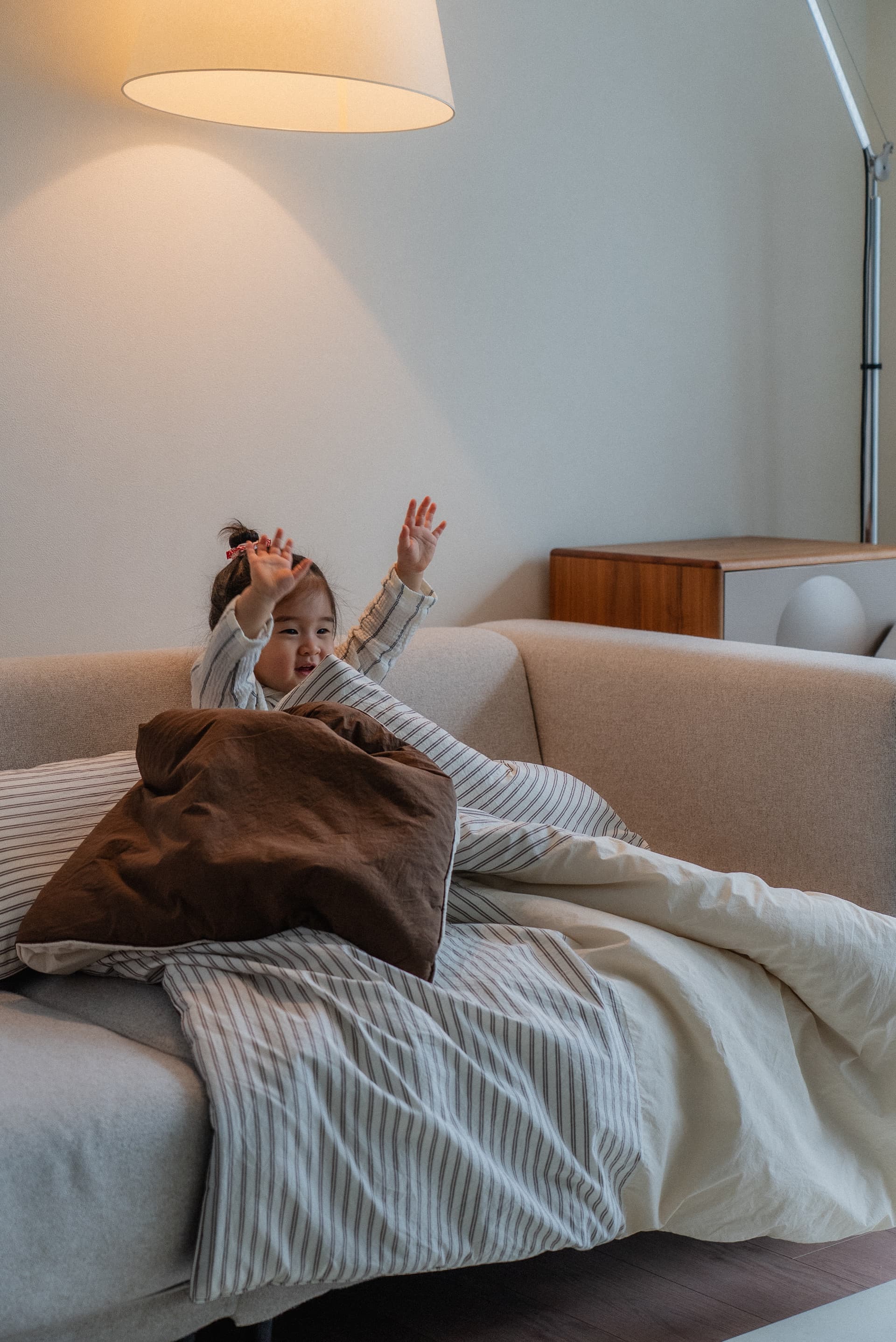 Warm light filters over our soft bedding collection creating a gentle sleep environment
